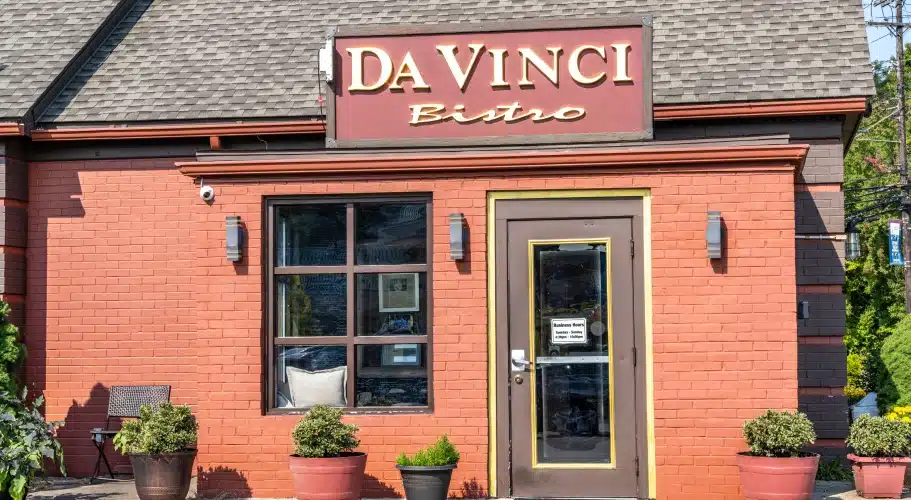 Vibrant storefront of Da Vinci Bistro with earthy tones and welcoming front patio décor